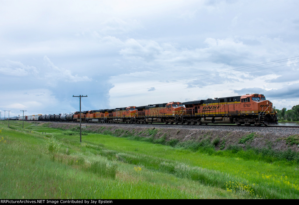 BNSF 5767 and 4 other units speed a westbound along the MRL 2nd Sub 